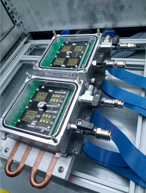 Two sealed device-holder modules connected inside an ARKEO installation