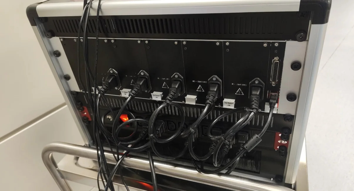 Rear view of an ARKEO rack showing power distribution and system connectivity