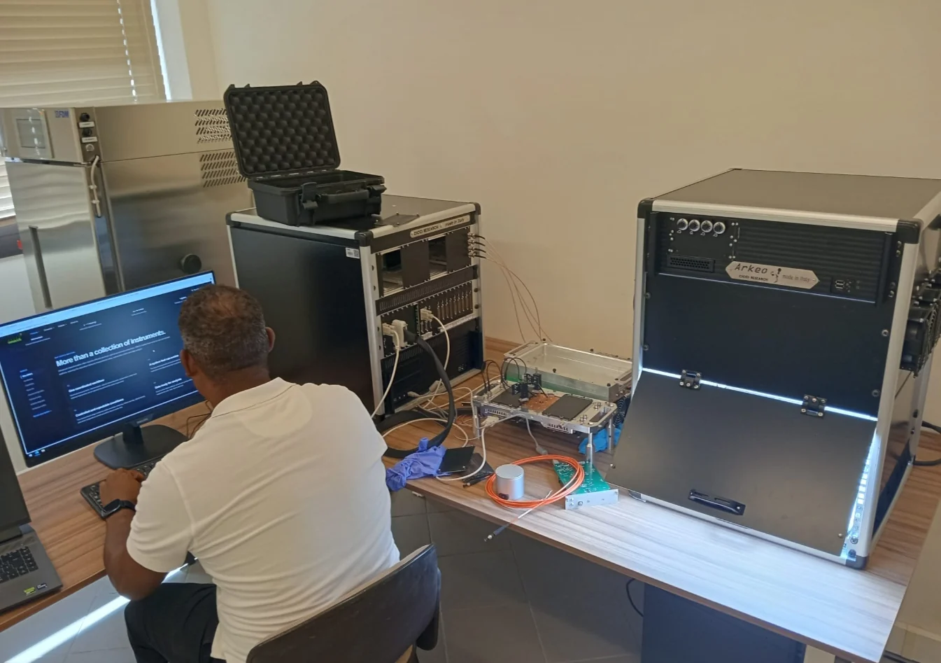 Engineer setting up and validating ARKEO systems in a laboratory